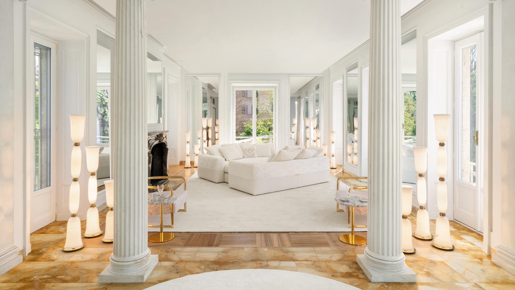 Versace Home collection displayed at Palazzo Versace, Milan, showcasing the brand's signature Baroque and Medusa design codes across furniture and living spaces